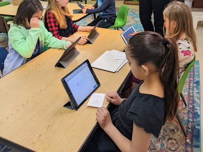 Technology Elementary kids completing projects on tablets